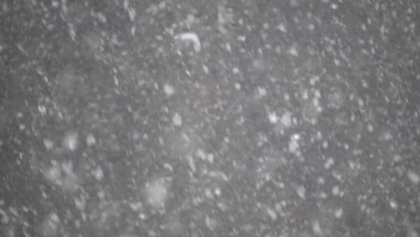 Snowflakes shoot across the screen in this blizzard scenic (High Definition)