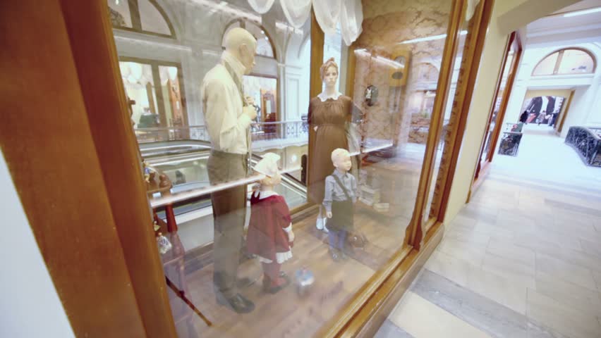 MOSCOW - JAN 20: Family mannequins in showcase at shopping center GUM on Jan 20, 2011 in Moscow, Russia. GUM building hosting more than thousand stores.
