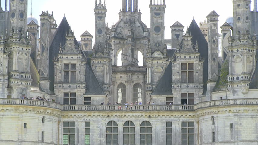 Chambord Castle, France during summer zoom out from roofs