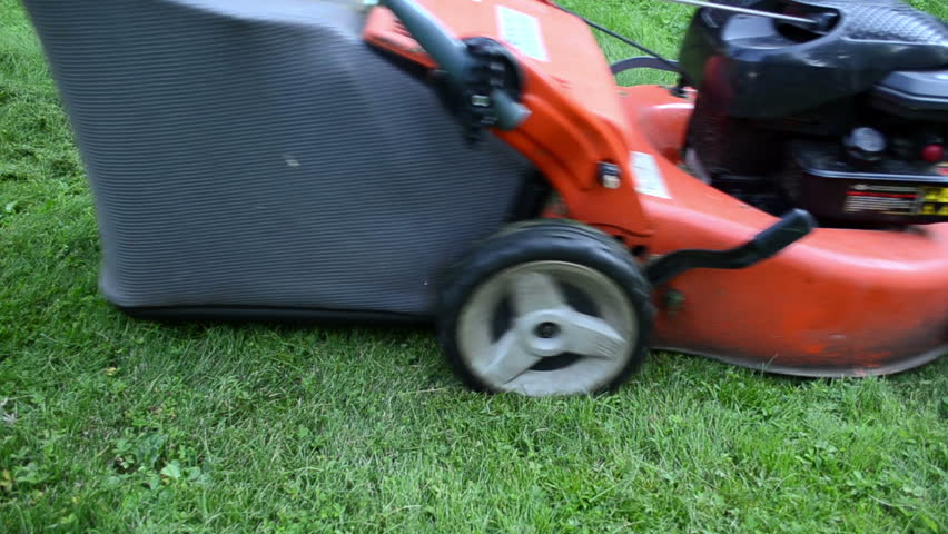 barefoot girl woman drive meadow grass cutter mower