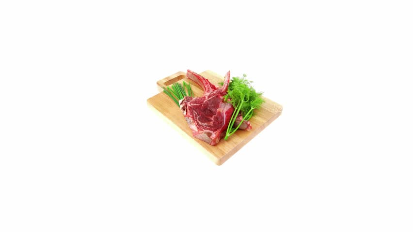 fresh raw meat : fresh red beef ribs with dill and green sprouts on wooden board isolated over white background
