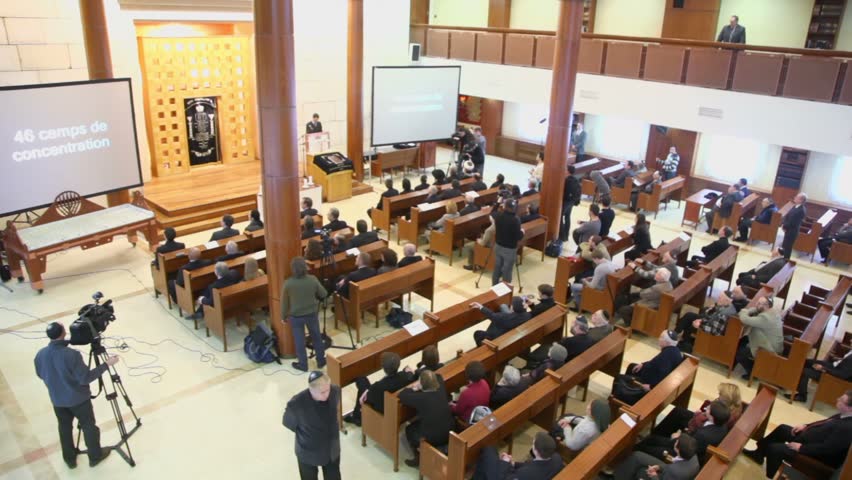 MOSCOW - JAN 27: Journalists and churchgoers in moscow synagogue Beis Menachem in International Holocaust Remembrance Day, on Jan 27, 2012, Moscow, Russia.
