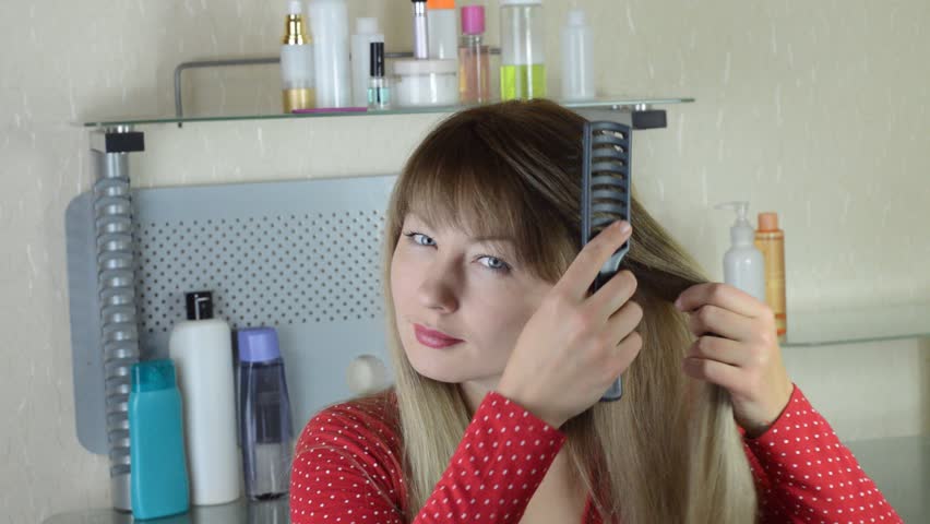 girl brushing her hair hairbrush