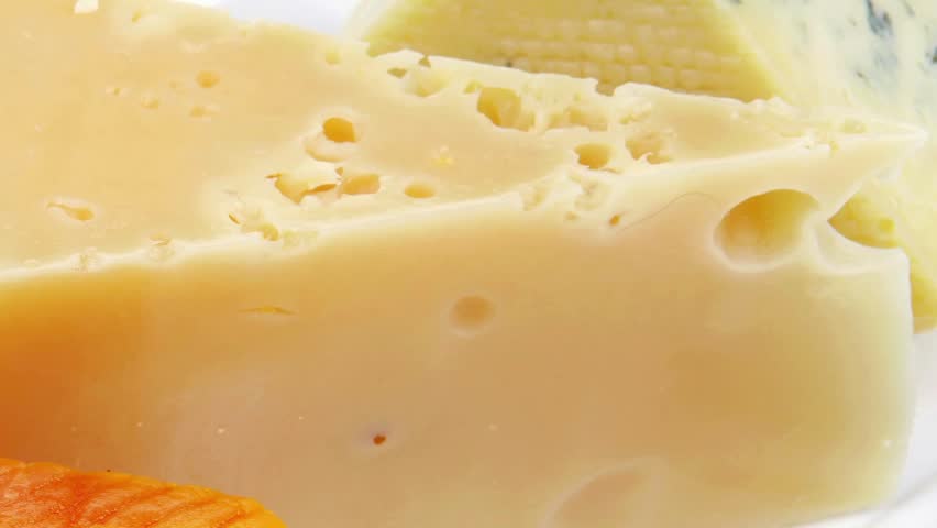 french delicatessen aged cheeses chops served on white plate isolated over white background