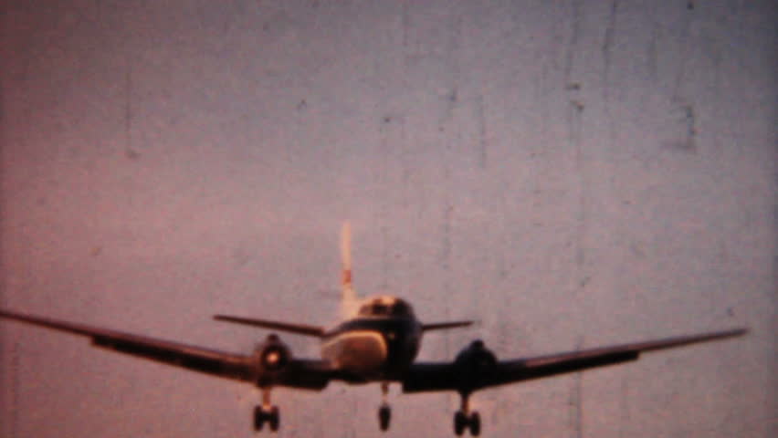 A shot of an airplane coming in for a landing in 1958 in Pennsylvania. 1958 Vintage 8mm film
