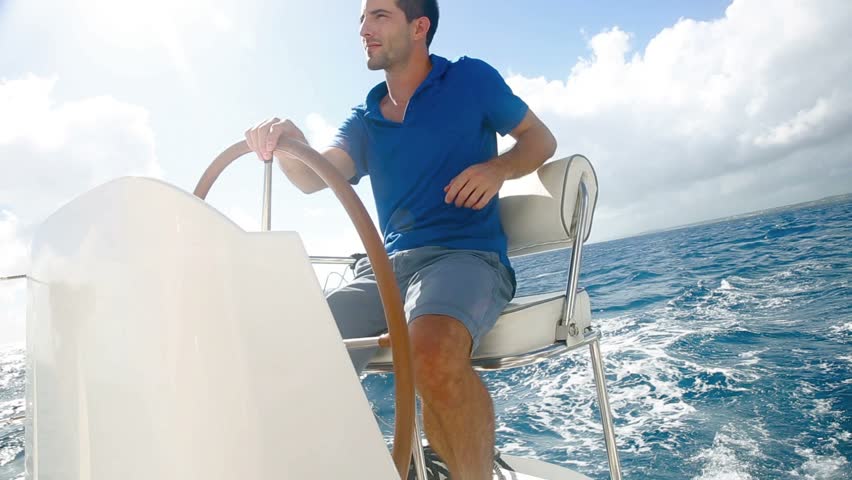 Young man sailing in caribbean sea 
