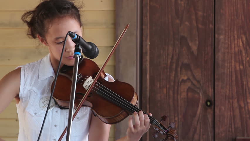 AGOURA HILLS, CA - MAY 20: A contestant fiddles away in a folk music band at the Topanga Banjo & Fiddle Festival in Agoura Hills on May 20, 2012. The long running festival is in its 52nd year.