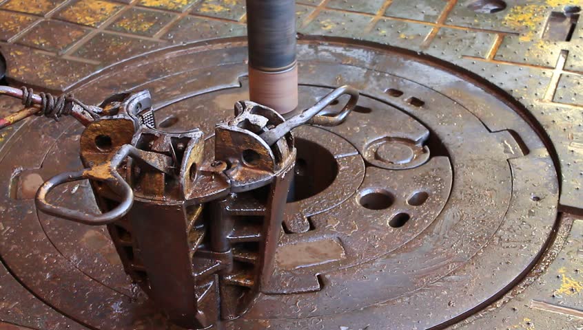 Slip on the rotary table while drilling oil well and pipe being rotated