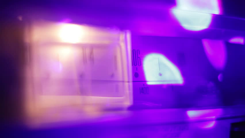 a glowing radio with the marker running through the different stations and frequencies