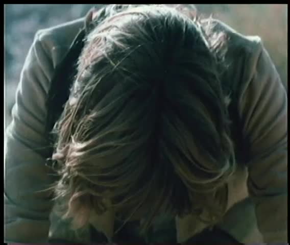 Close-up of a man with head down