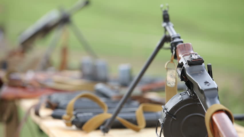 Lots of ammunition placed on a table.
Ammunition on a table.