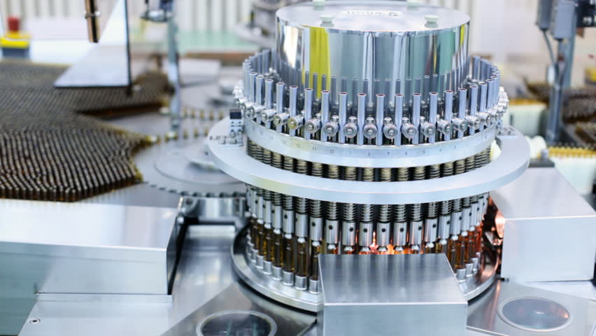 Automatic optical inspection machine, inspects vials and ampoules for particulates in liquid and container defects.