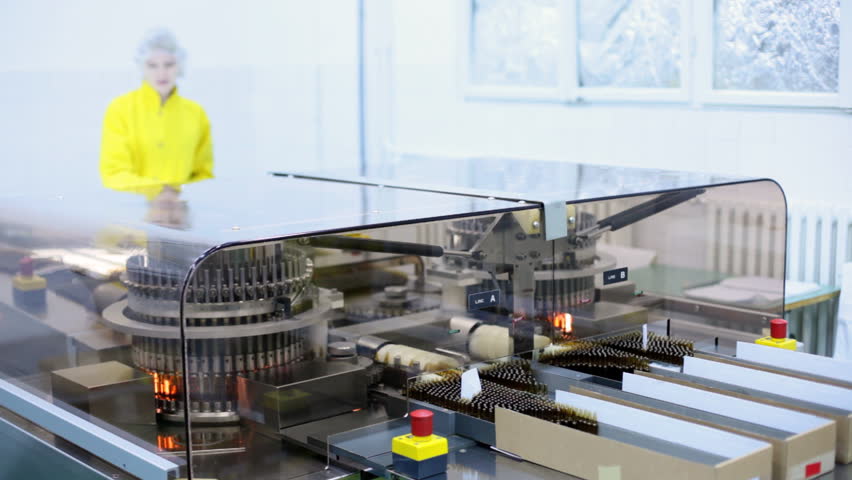 Automatic optical inspection machine, inspects vials and ampoules for particulates in liquid and container defects.