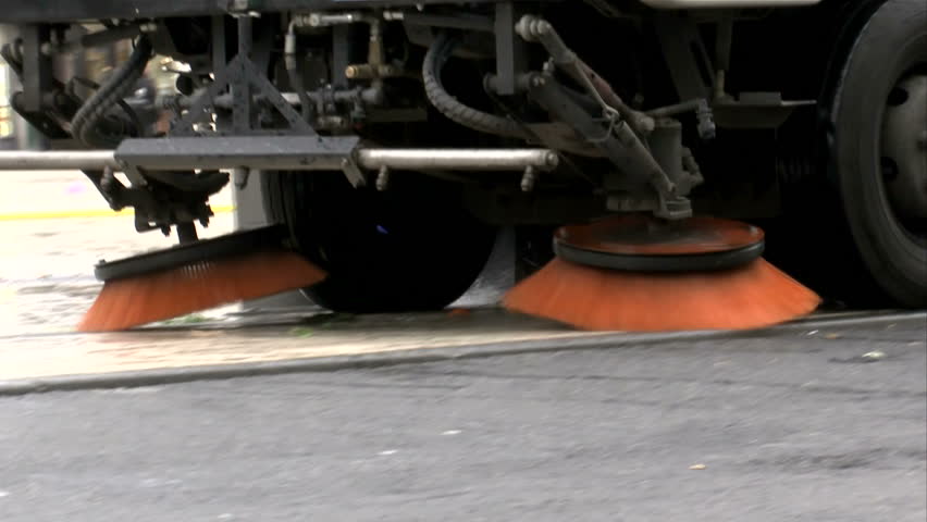 Street cleaning machine brushes, close up, sweep refuse from city streets. 1080p