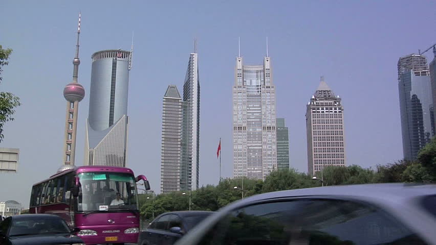 SHANGHAI, CHINA - CIRCA OCTOBER 2007: Traffic on Century Avenue with Hi Rise Buildings of Financial District Lujiazui