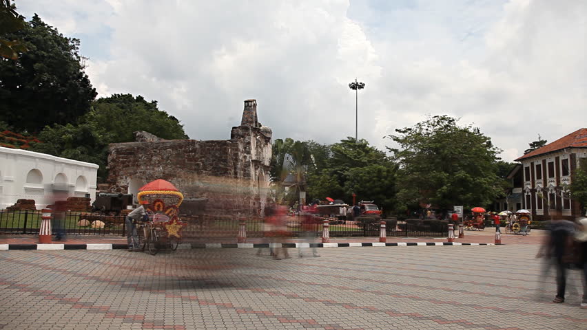 MALACCA 4 November: timelapse of trishaw driving in the street of Malacca in front of the A Famosa on  4th November 2012