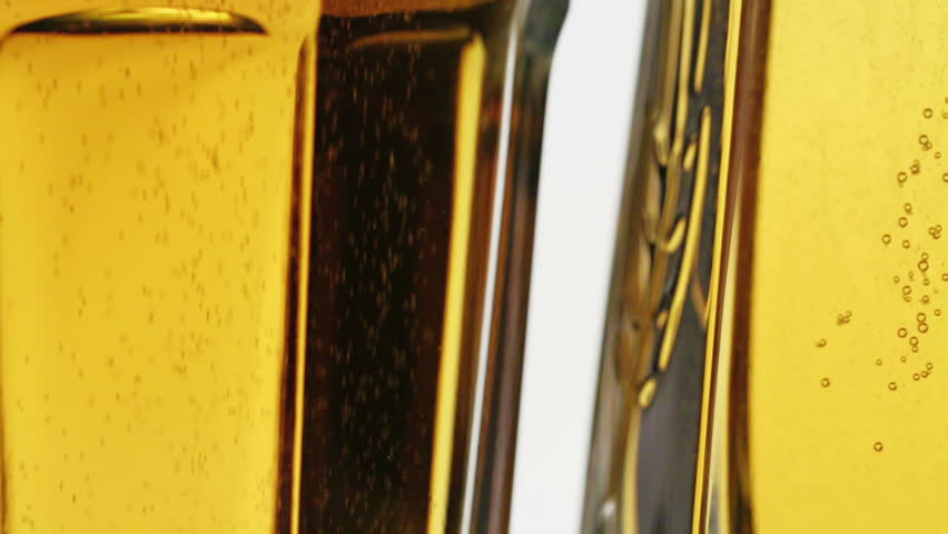 Lager beer glass with bubbles, sliding video