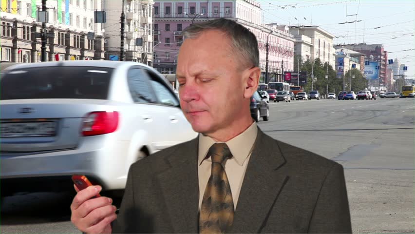 Man on the phone. In the background, machinery transport time Laps
