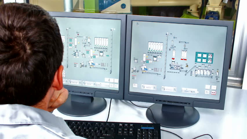factory dashboard ; worker's computer controls the operation of machinery in the factory,video clip