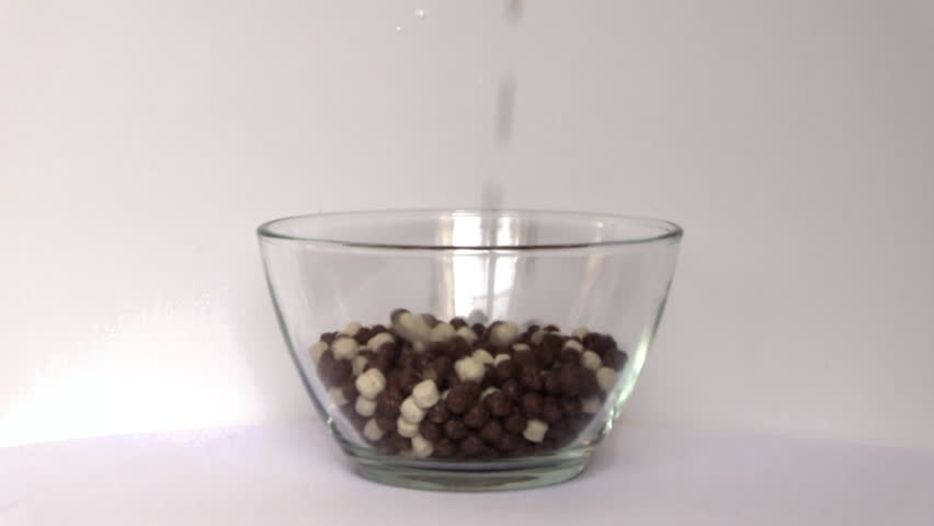 cereal and milk chocolate balls on a white background in a glass Diet