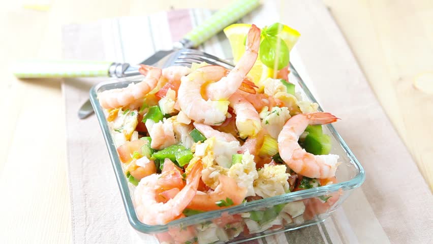 seasoning a ceviche bowl with olive oil