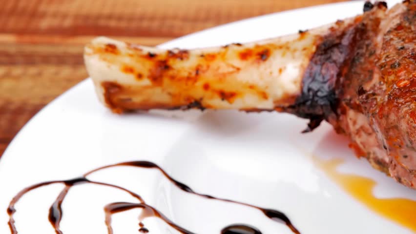 meat savory: roast shoulder on black plate hidef slow motion intro