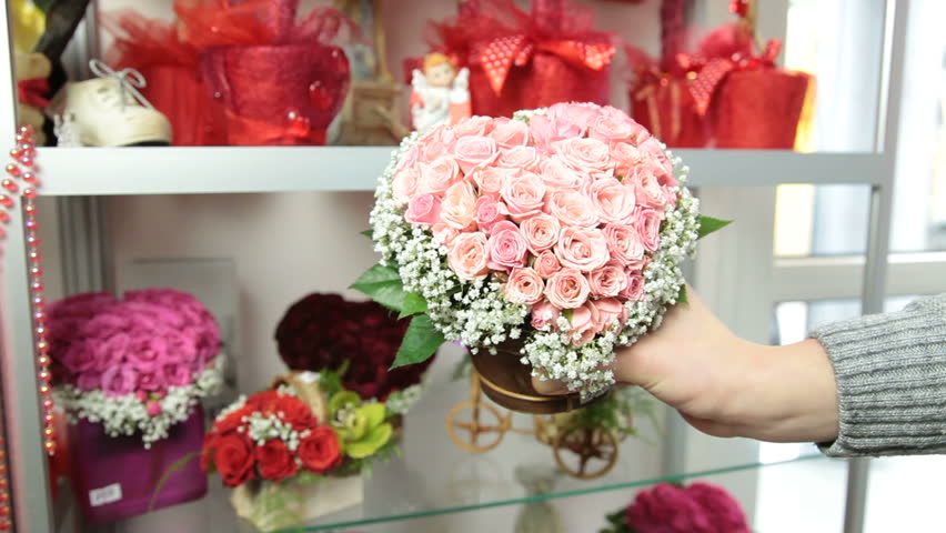 Florist Serving Customer in Flower Shop, Man Buying Rose Basket Arrangement, Closeup, Focus On The Bouquet