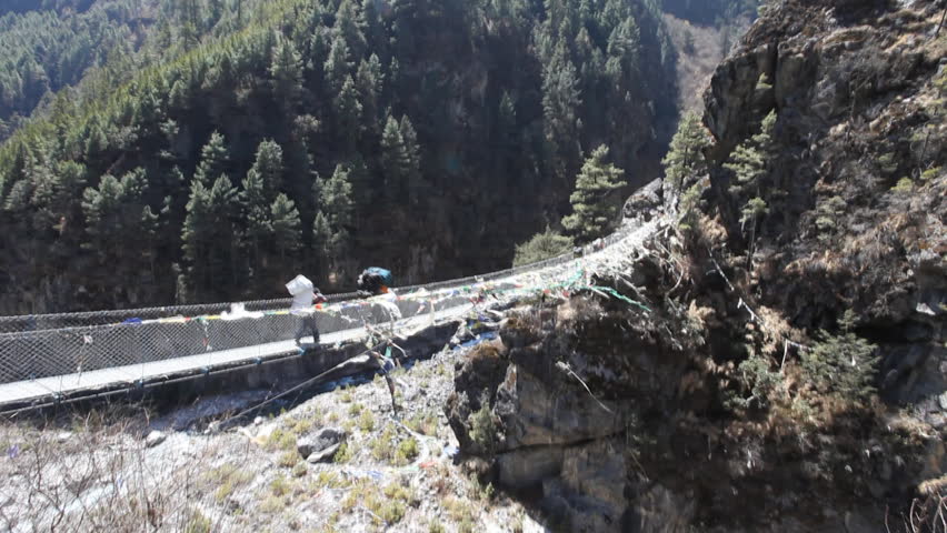 Sherpas carrying a full load of supplies to Everest Base Camp.