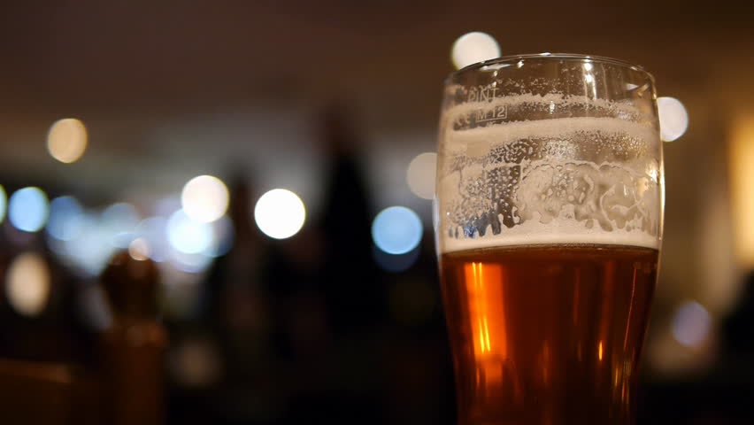 Beer Glass in a Pub.
Half drunk glass of beer with an out of focus pub background.
