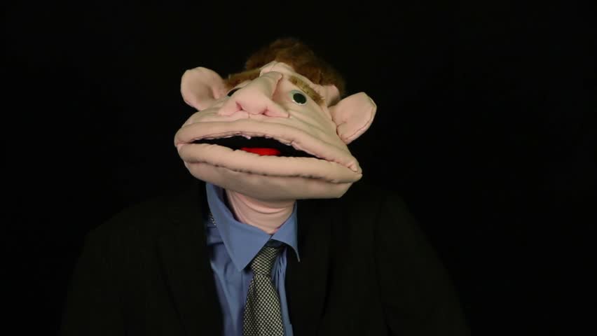 Puppet says on a black background
