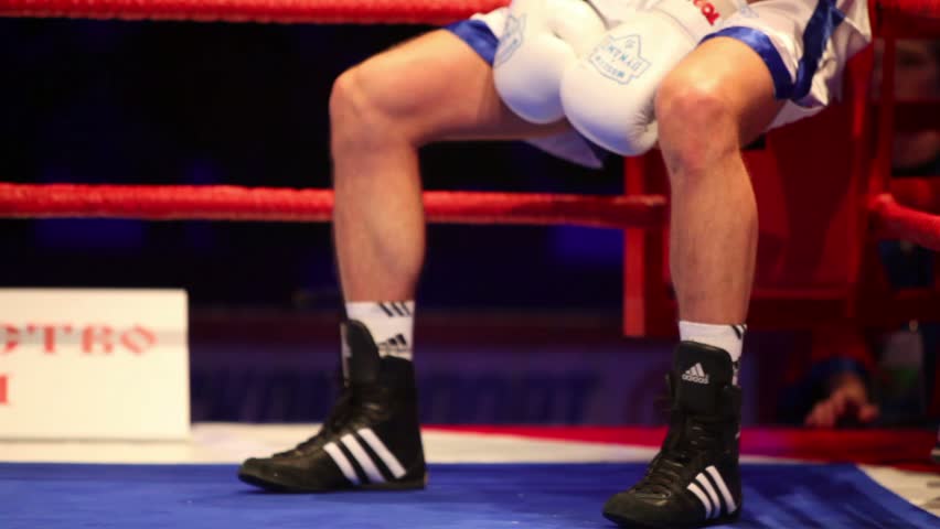 MOSCOW - JAN 13: Boxer returns to the ring after a break between rounds in WSB match at Krylatskoye Sports Palace Basket-Hall, Jan 13, 2012, Moscow, Russia. WSB cultivates sporting values in boxing.