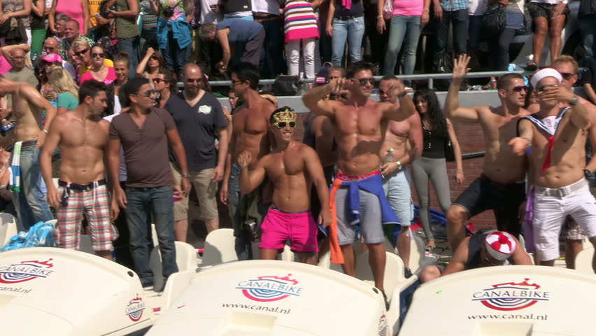 AMSTERDAM, HOLLAND - AUGUST 4: Gay Pride Canal Parade Amsterdam 2012 filmed from one of the parading boats - August 4, 2012 in Amsterdam, the Netherlands.