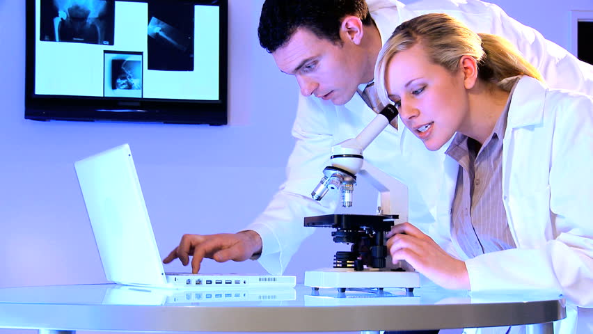 Medical students using laboratory equipment for patient healthcare