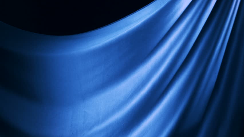 Blue silk fabric flying in the air shooting with a high speed camera.