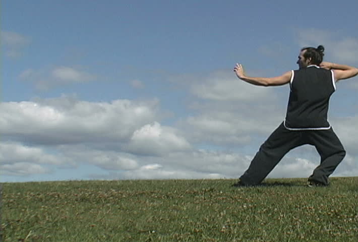 Video of man meditating and doing tai-chi in a natural surrounding with plenty of space to ad your own elements.