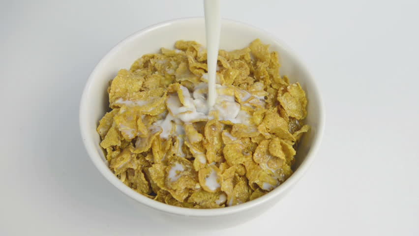Pouring milk on Cornflakes