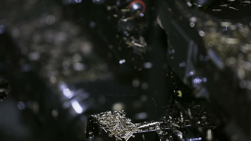 Processing a spare part of brass in the lathe industrial