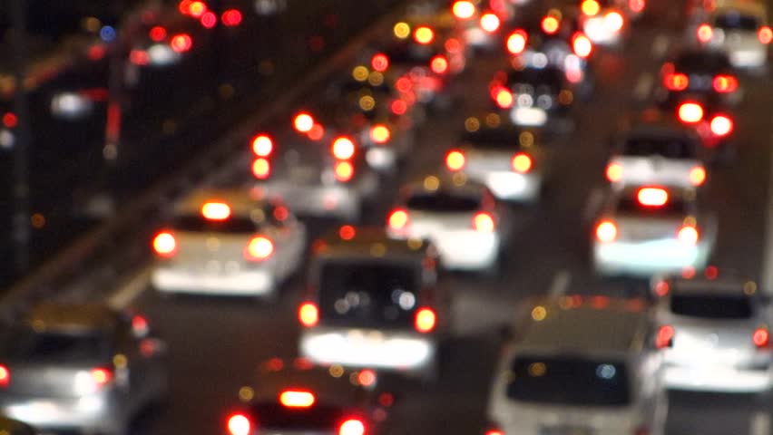 Traffic jam on a highway at night, out of focus