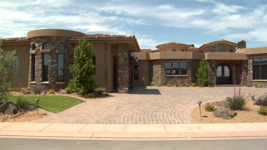 large desert home with circular driveway