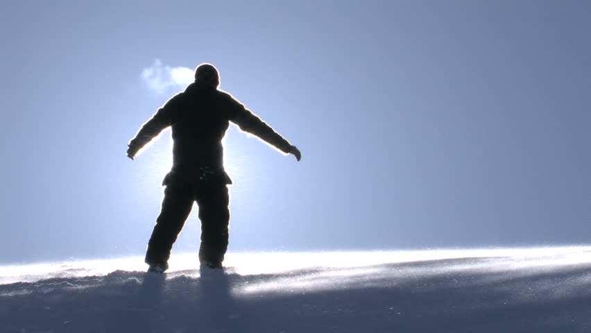 Man in a Worship Pose on Top of a Mountain