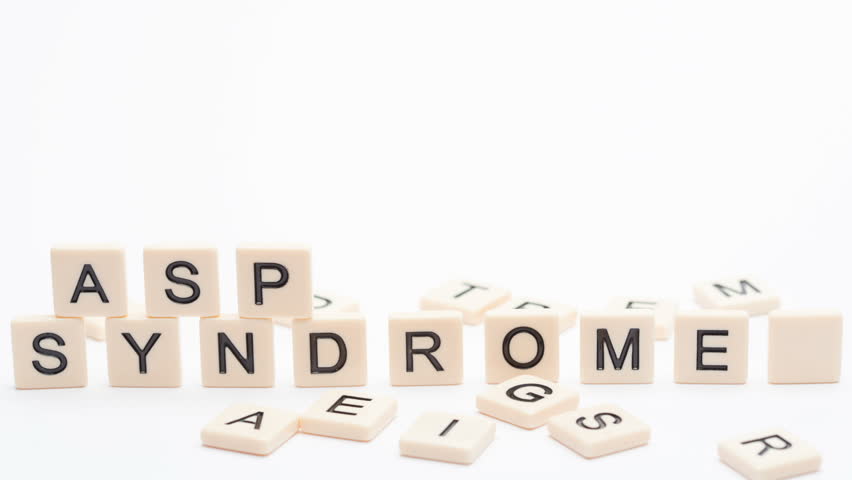 Autism and asperger spelled out in plastic letter pieces in stop motion