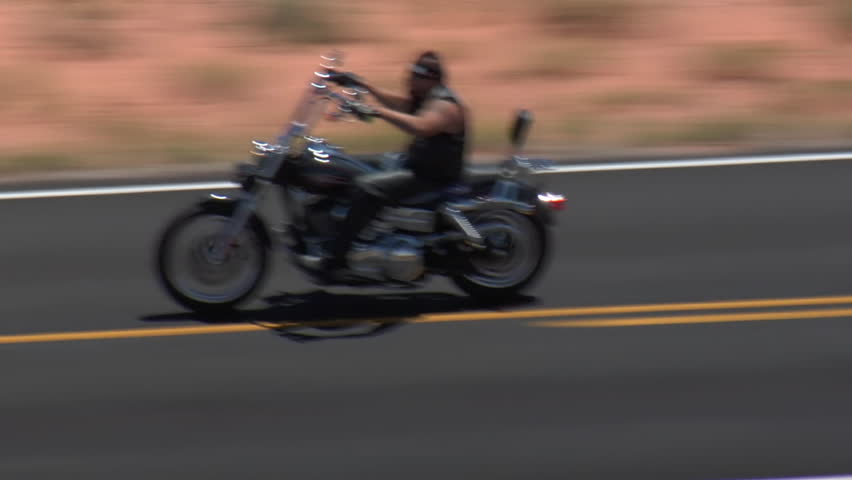 aerial shot of three motorcycles on Monument Valley Highway