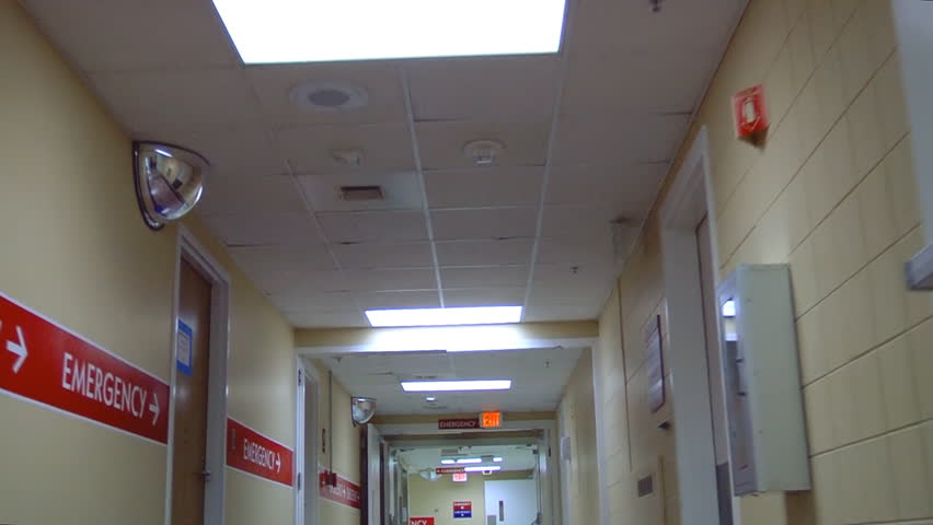 Patient point of view of a hospital hallway leading to the emergency room