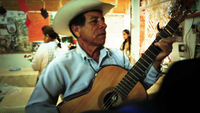 IXCATEOPAN, MEXICO - CIRCA FEBRUARY 2012: Mariachi playing smiling during the celebration in memory of the last Aztech emperor