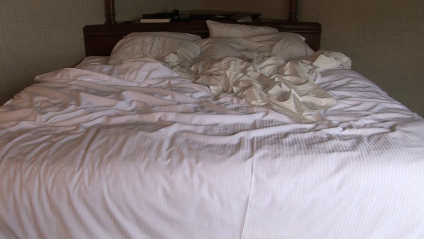 Family of three jumps on the bed, Seattle, Washington