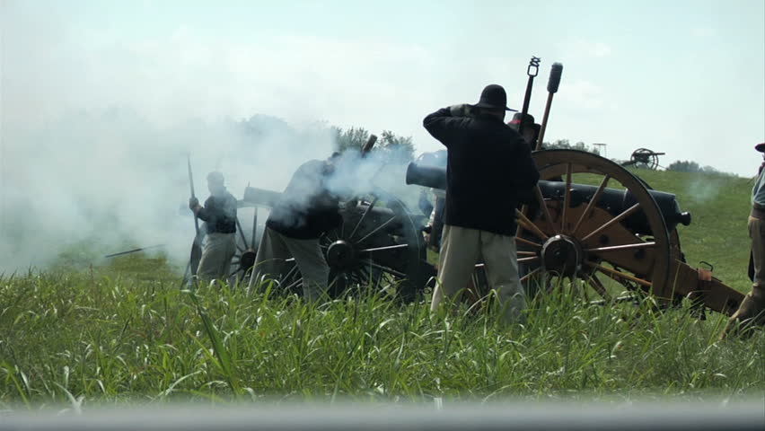 CHICKAMAUGA, GEORGIA - OCTOBER 2008 - large-scale, epic Civil War anniversary reenactment -- in the middle of battle.  Union Artillery fires in volley at the attacking Confederates.