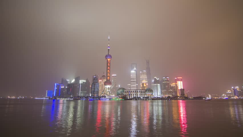 SHANGHAI - CIRCA 2013: Time Lapse of river traffic by Pudong, Shanghai, China from Day to Night Push In. Photo Sequence from DSLR camera and Post production in After Effects