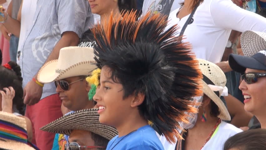 BARRANQUILLA, COLOMBIA - FEBRUARY 9: A crowd watches the parade at Barranquilla's Carnaval shown on February 9 2013 in Barranquilla, Colombia.