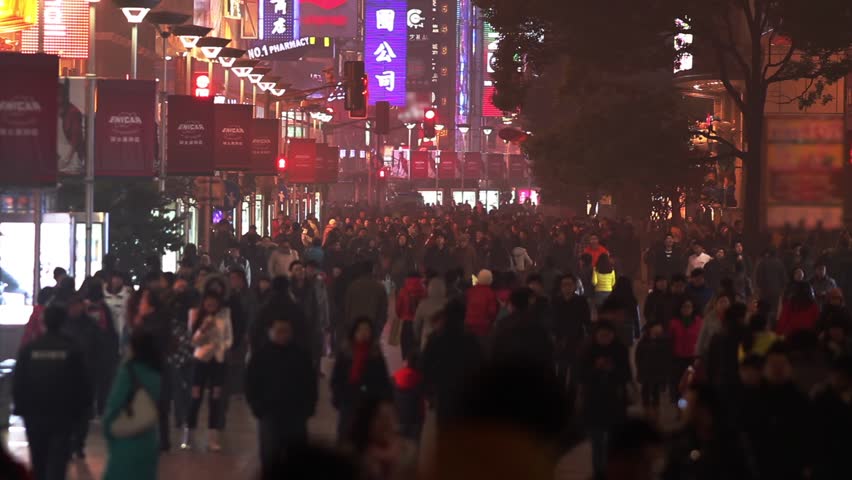 SHANGHAI - CIRCA JANUARY 2013 - Slow Motion of a Busy Night Crowds Traffic on Nanjing Road in Shanghai, China
