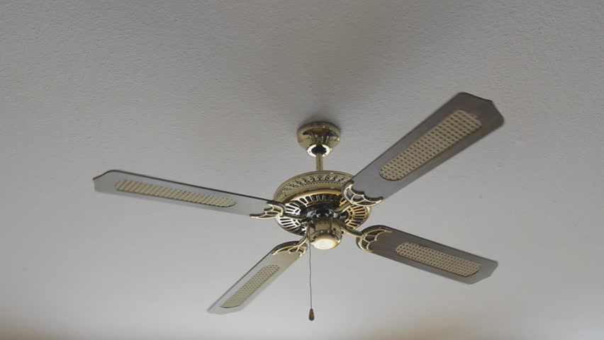 Electric fan on ceiling is stopping